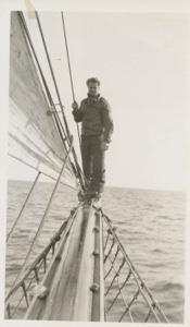 Image: Man standing on boom of the Thebaud